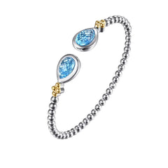 Sterling Silver and 14K Yellow Gold Blue Topaz Cuff